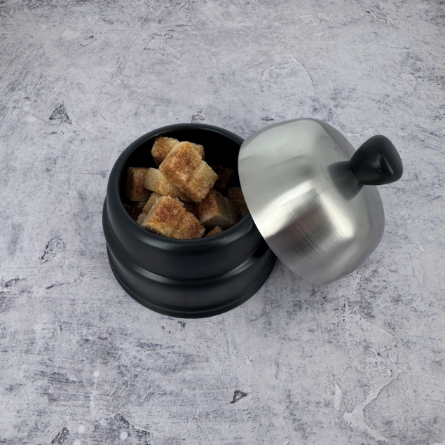 Discover the generous capacity of the Salam black ceramic sugar bowl, perfect for serving cane sugar cubes at the French table.
