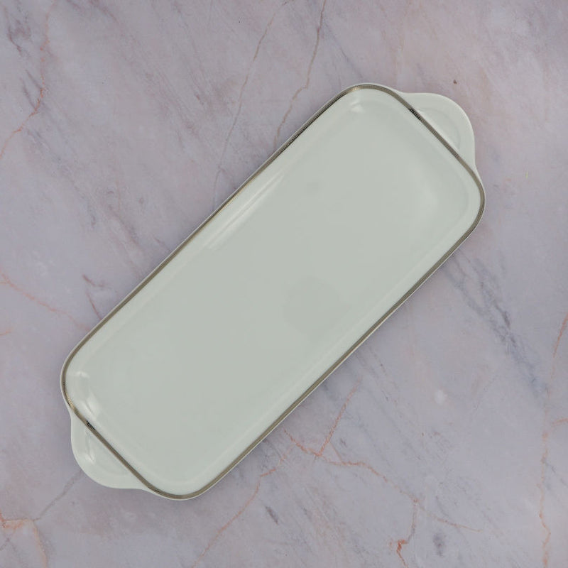 Empty Degrenne cake dish on Marble
