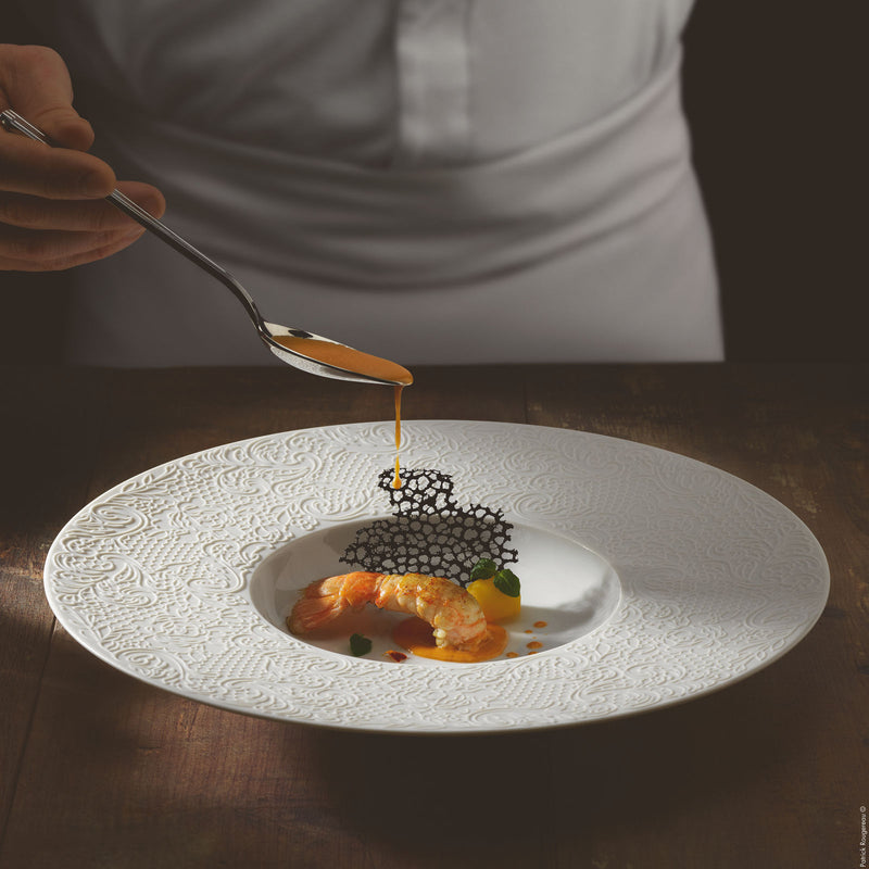 Degrenne round shallow bowl with a cook and sauce